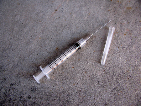 Syringe lying on the ground