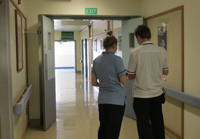 Photo of staff talking in a corridor